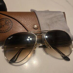 Brown aviator RayBan sunglasses